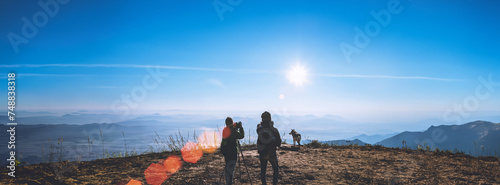 Photographer lover women and men asians travel relax in the holiday. Photograph mountain landscapes atmosphere in the morning. In the winter. In Thailand