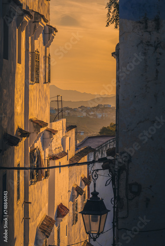 Sunset over an old street in the town 