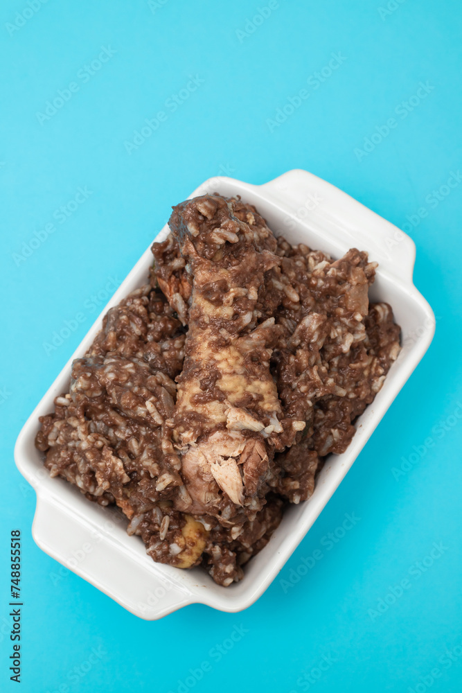 Typical portuguese dish chicken with rice in ceramic dish. Typical portuguese dish chicken with rice in ceramic dish.