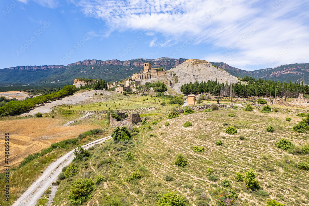 Aerial view of ruins of village of Escó by Yesa reservoir in Spain, Summer 2023