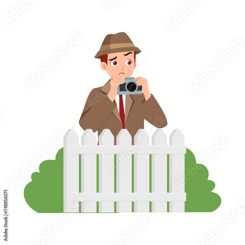 detective hide in the bush and holding binocular