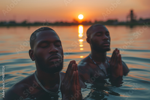 men taking ritual bath in the river in early morning photo
