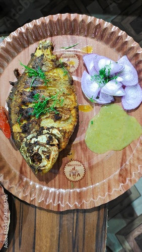 Tasty fish fry with Indian spices served on table