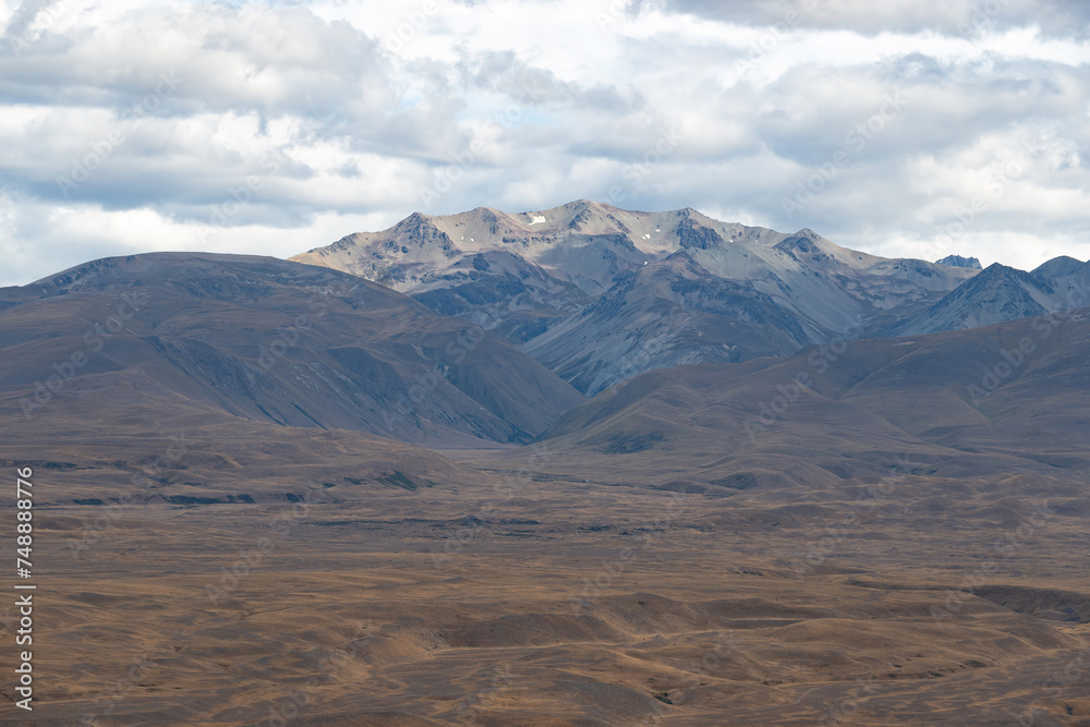 A beautiful breathtaking scene of a massive mountain range from University of Canterbury Mt John Observatory, Mt John hill, Lake Tekapo, New Zealand.