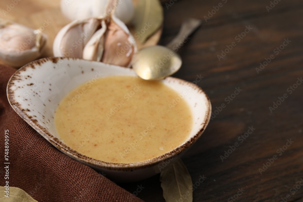 Delicious turkey gravy served on wooden table, closeup. Space for text Delicious turkey gravy served on wooden table, closeup. Space for text