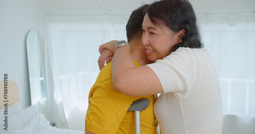 Embracing couple shares a heartfelt hug in a minimalist white room, emotions visible on their faces Embracing couple shares a heartfelt hug in a minimalist white room, emotions visible on their faces