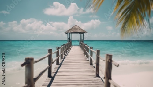 Tropical pier to paradise island beach. Amazing ocean lagoon, sea horizon under blue sky. © Adi