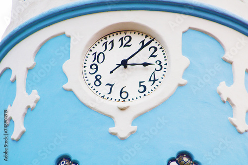 Clock on the fasade of the Hungarian Secessionist Catholic cathedral or the Blue Church in the old town in Bratislava, Slovakia. photo
