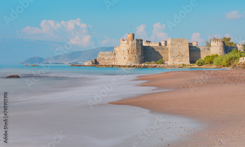 Historical Stone walls of Mamure Castle on Mediterranean coast. Anamur - Mersin, Turkey. photo