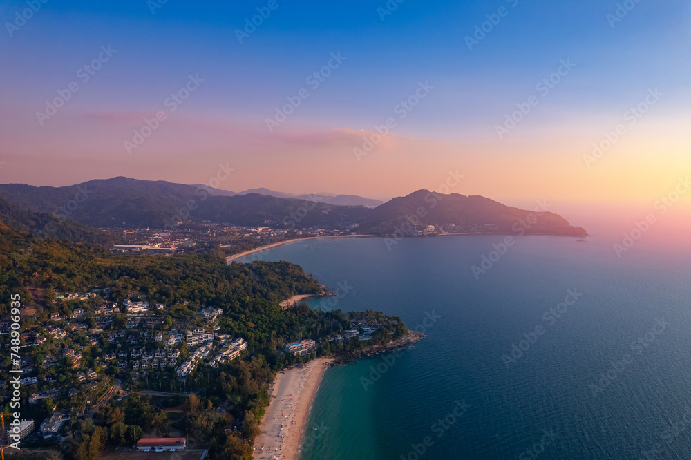 Aerial top view panorama sunset Surin beach with sea of Phuket paradise. Concept tropical travel photo Thailand