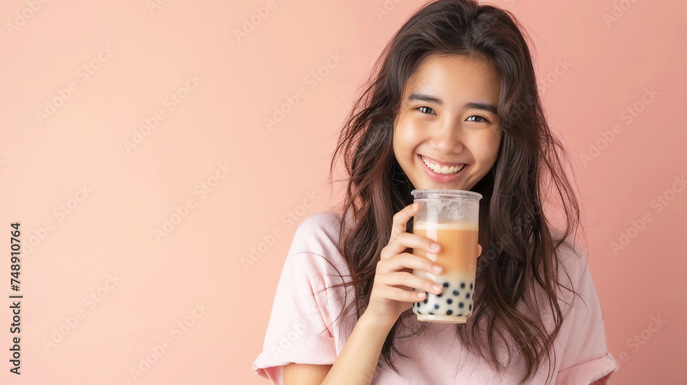 Happy Asian beautiful woman holding glass of bubble tea in her hand . Happy Asian beautiful woman holding glass of bubble tea in her hand .