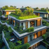 A modern green street consisting of houses with grass on the roof and plants on the balconies. Eco settlements