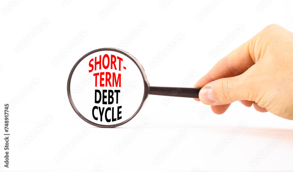 Short-term debt cycle symbol. Concept words Short-term debt cycle on beautiful magnifying glass. Beautiful white table background. Businessman hand. Business Short-term debt cycle concept. Copy space Short-term debt cycle symbol. Concept words Short-term debt cycle on beautiful magnifying glass. Beautiful white table background. Businessman hand. Business Short-term debt cycle concept. Copy space