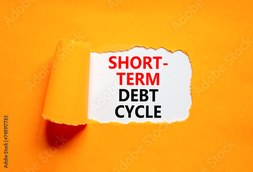 Short-term debt cycle symbol. Concept words Short-term debt cycle on beautiful white paper. Beautiful orange background. Business Short-term debt cycle concept. Copy space photo