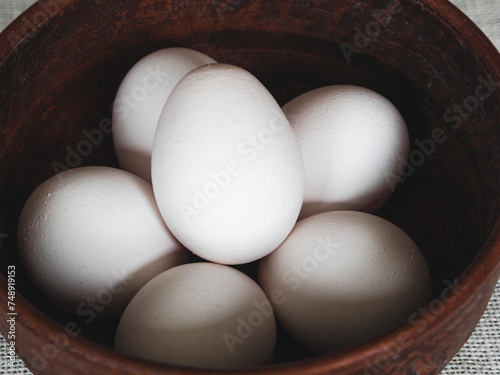 Chicken eggs in a clay bowl. Eggs to Easter