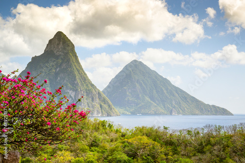 Stunning view of the Pitons (Petit Piton & Gros Piton). from an elevated viewpoint with the rainforest and bay ..Soufriere,.Saint Lucia, .West Indies, Eastern Caribbean