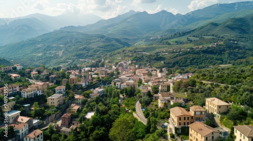 A scenic view of a small town nestled in the mountains. Perfect for travel brochures