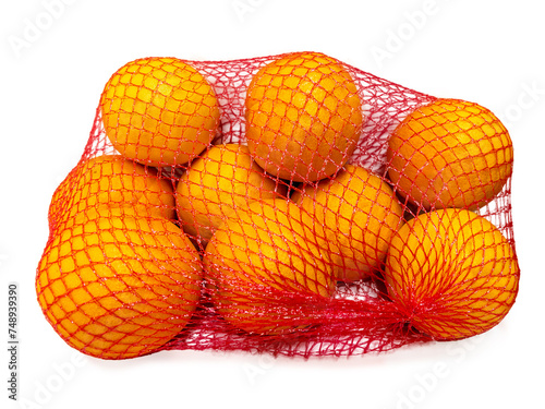 Oranges in yellow plastic net isolated on white with clipping path. Oranges fruit packaged for sale
