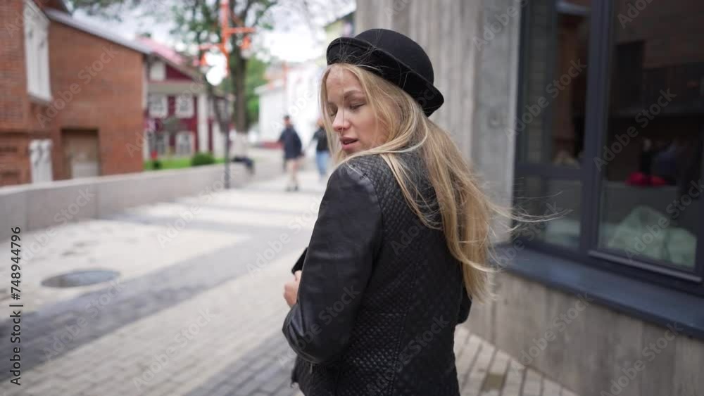 A female model walks and poses for the camera. A female model walks and poses for the camera.