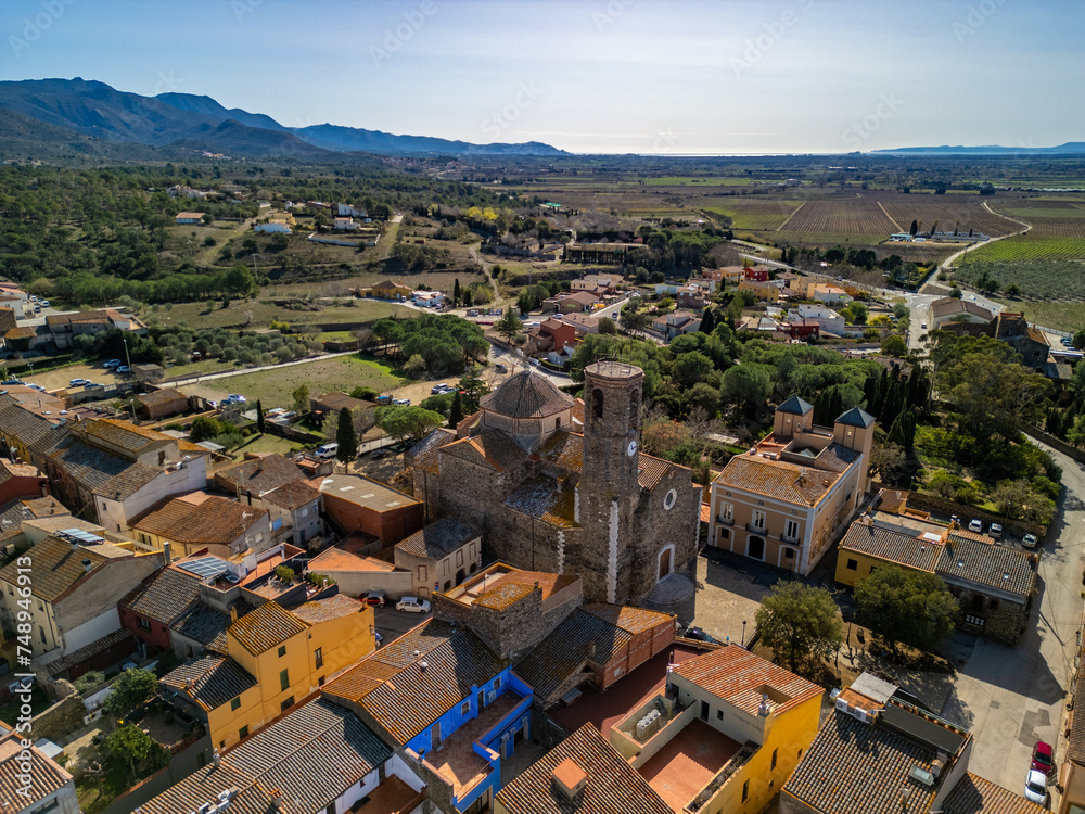 Discover the timeless allure of Garriglella medieval heritage showcased in aerial images against the breathtaking backdrop of Costa Brava.
