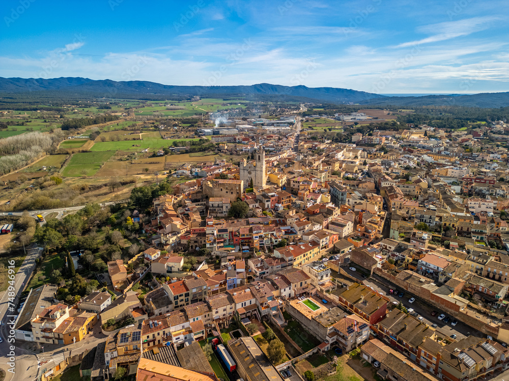 Immerse yourself in the picturesque landscapes of Llagostera's medieval towns, captured in stunning aerial images along Costa Brava.
