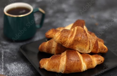 Freshly baked croissants, isolated on white background. 
