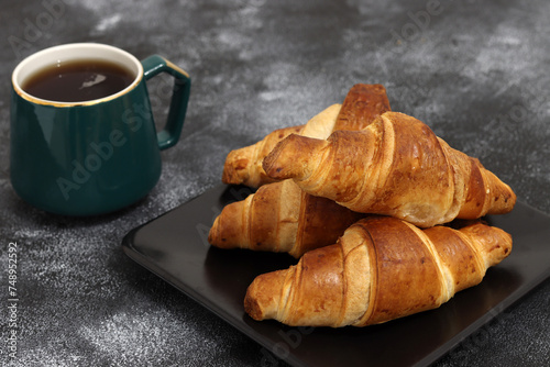 Freshly baked croissants, isolated on white background. 