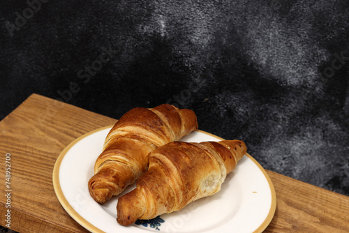 Freshly baked croissants, isolated on white background. 