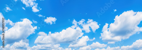 Scenic and Beautiful Bright blue sky with puffy clouds on a clear sunny day © G