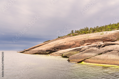 Ostseeküste mit Felsen auf der Insel Blå Jungfrun in Schweden photo
