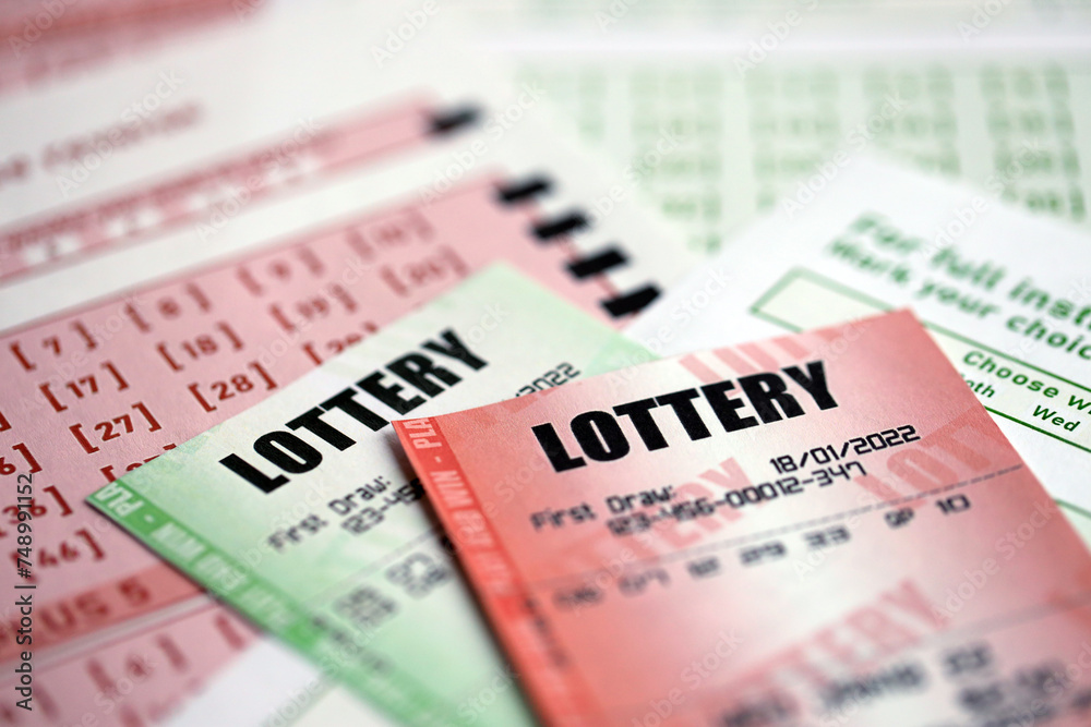 Green and red lottery tickets on blank bills with numbers for playing lottery close up Green and red lottery tickets on blank bills with numbers for playing lottery close up