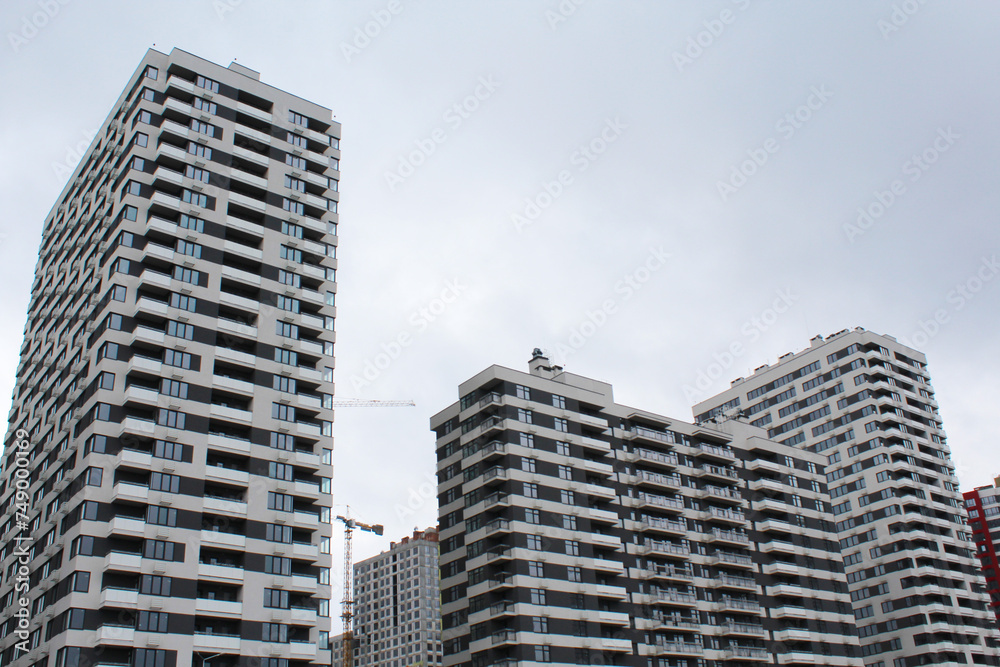 buildings. construction with a crane of a modern office building against the background of high-rise buildings in the city of Kyiv, Ukraine