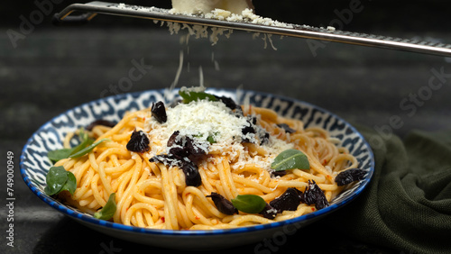 spaghetti bolognas with cheese and olive photo