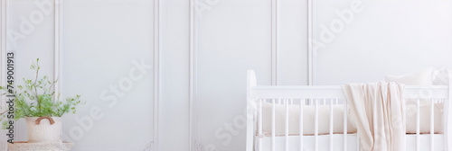 White minimalist nursery with a crib and a plant in a basket