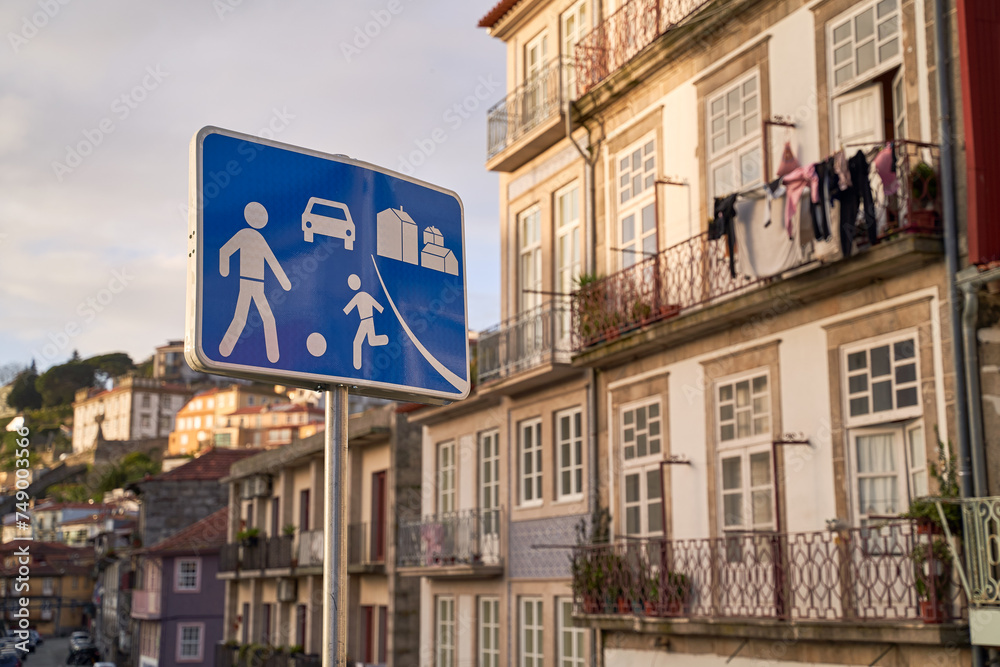 Home zone road sign in Porto, Protugal on old houses background