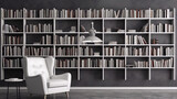 3d illustration of a modern library interior with a white armchair, bookshelves, and a lamp.