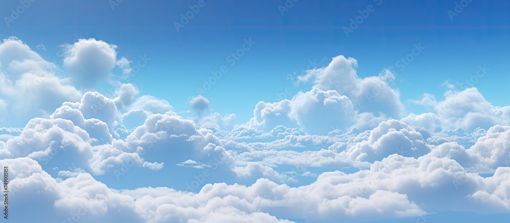 The blue sky is covered with an array of fluffy white clouds, creating a picturesque scene. The clouds are scattered across the sky, adding depth to the vast expanse above. The blue sky is covered with an array of fluffy white clouds, creating a picturesque scene. The clouds are scattered across the sky, adding depth to the vast expanse above.