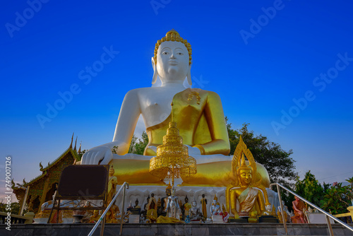 Big Buddha Chiangmai Mountain thailand. Big Buddha statue situated on a mountain ridge in Chiang Mai overlooking the city and airport Lovely background Sky
