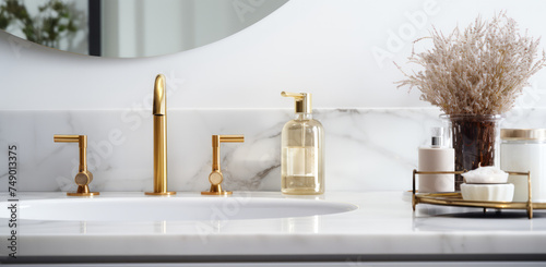 a room with a bathroom with white marble countertop and gold