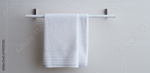 a towel rack sitting in a small white bathroom