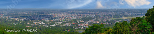 Fototapeta Naklejka Na Ścianę i Meble -  Panorama view of Chiangmai Chiang Mai city taken from Doi Suthep Mountains. Lovely views of the Old city at Sunset Sunrise lovely tropical mountains and beautiful nature in the foreground