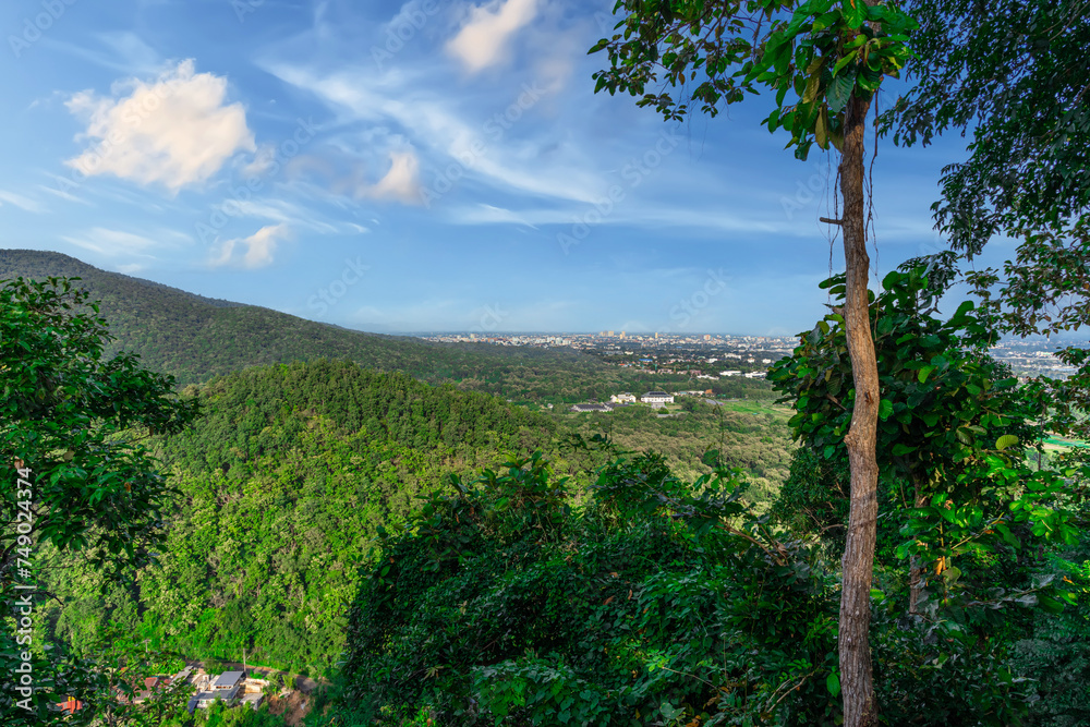 Fototapeta premium Panorama view of Chiangmai Chiang Mai city taken from Doi Suthep Mountains. Lovely views of the Old city at Sunset Sunrise lovely tropical mountains and beautiful nature in the foreground