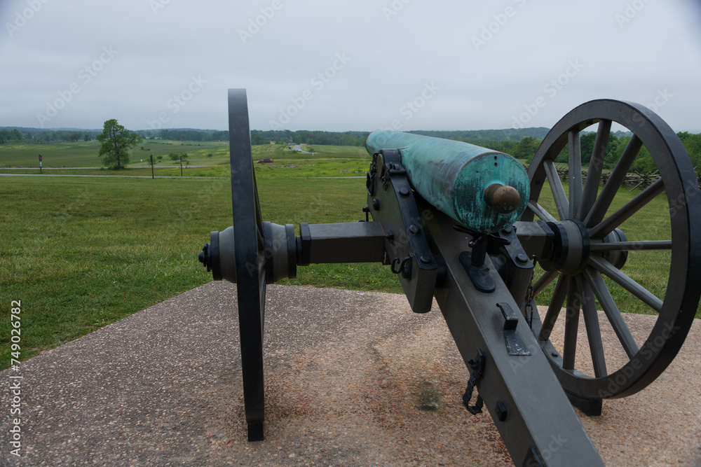 12 pounder bronze smooth bore, Napoleon Model 1857 at Gettysburg National Military Park, Pennsylvania. Battlefield in the background