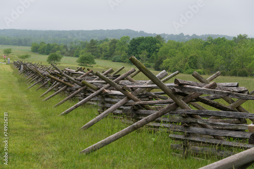 Fototapeta Naklejka Na Ścianę i Meble -  Stacked wooden fence on the edge of the Gettysburg battlefield, site of the bloodiest battle of the Civil War