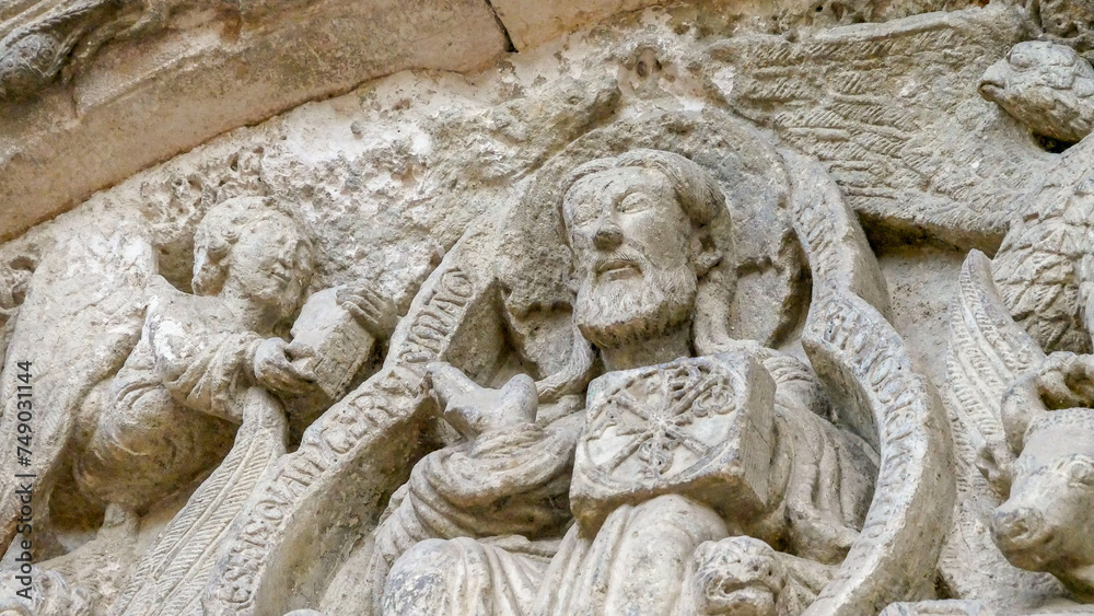 Stone image of an episode from religion on the wall of the church Stone image of an episode from religion on the wall of the church