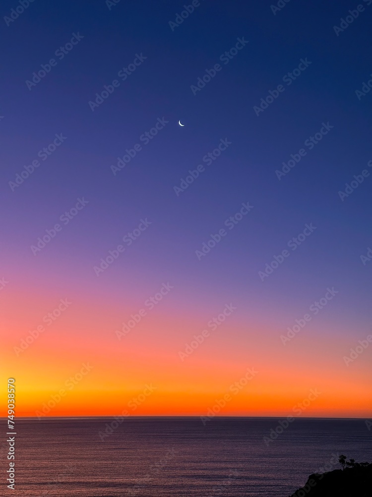 Slip moon and sunset colours, Taranaki, New Zealand