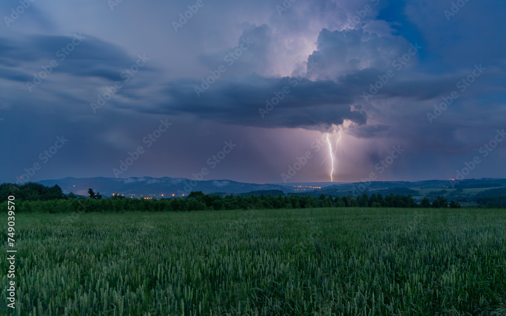 Lightning flash against the background of mountains