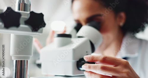 Woman, scientist and forensic examination with microscope for science, microbiology or discovery at lab. Closeup of person or researcher looking in scope or lens for scientific breakthrough or test photo