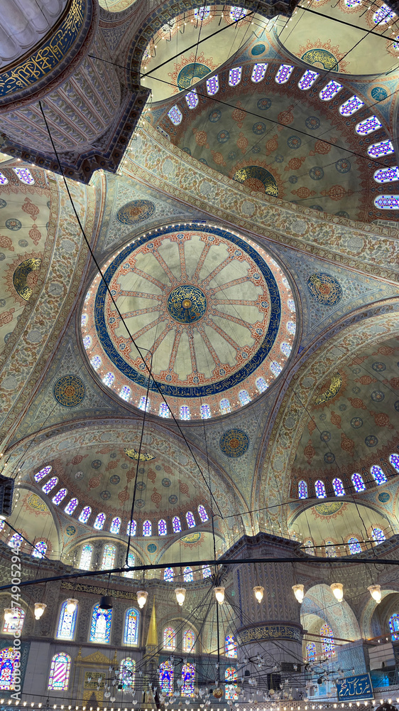 panoramic vertical of the ceiling of the blue mosque in istanbul, with colorful stained glass windows, its large arches, impressive ceiling with its central vault, Sultan Ahmed Mosque, kaleidoscope