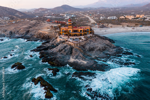 Aerial view capturing the breathtaking natural beauty of Cerritos Beach in Baja California, Mexico. The expansive stretch of beach showcases its golden sand, embraced by the deep blue sea, while waves